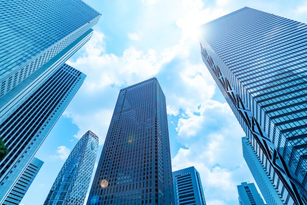 looking up at modern skyscrapers in city